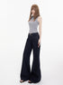 Angled view of wide leg jeans with front pockets and belt loops on standing model