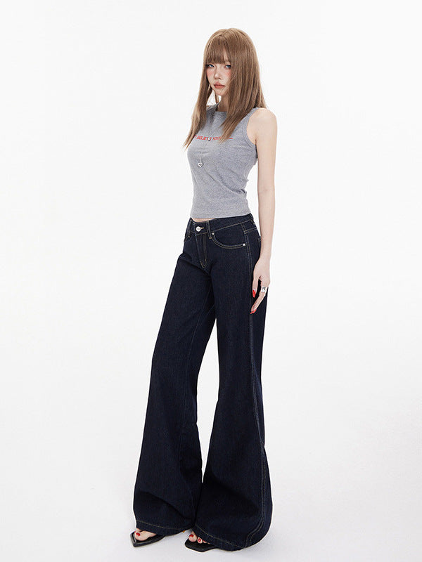 Angled view of wide leg jeans with front pockets and belt loops on standing model