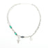 Full view of Y2K-style layered necklace with star and letter charms on white background.