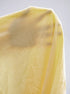 Close up of yellow skirt set fabric polyester blend texture