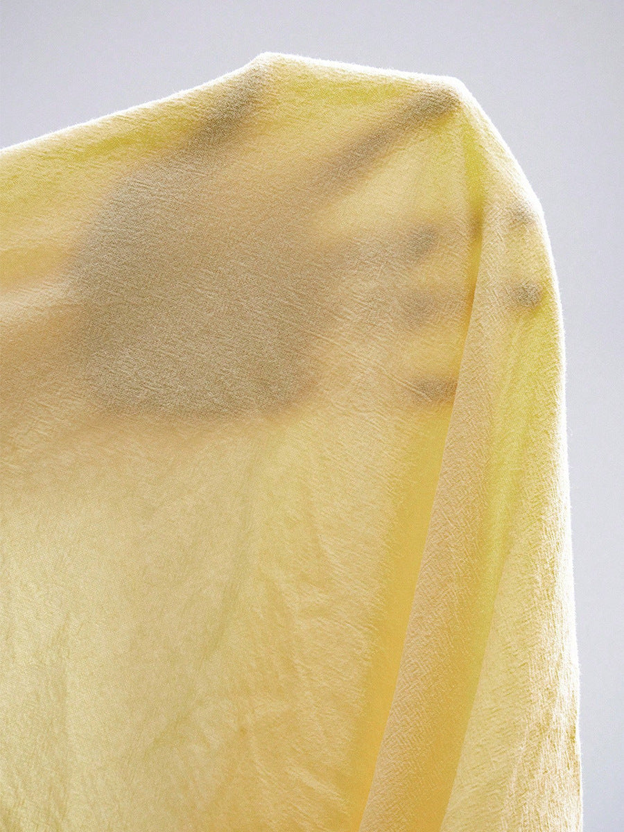 Close up of yellow skirt set fabric polyester blend texture