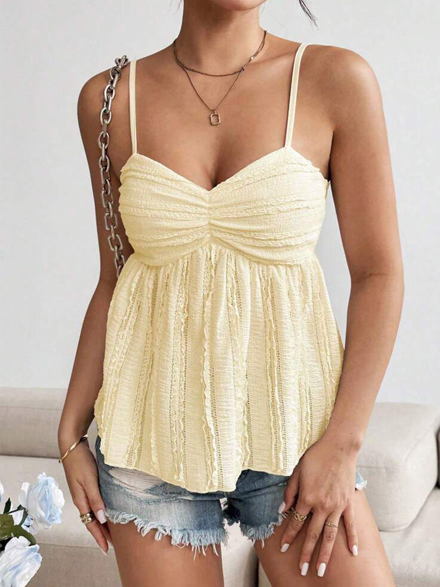 Woman wearing smocked yellow tank top with spaghetti straps and flared hem