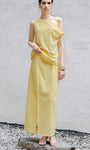 Yellow two piece skirt set with one shoulder sleeveless top and midi skirt