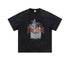 Flat lay of black tee with distressed red lettering and cigarette warning graphic.