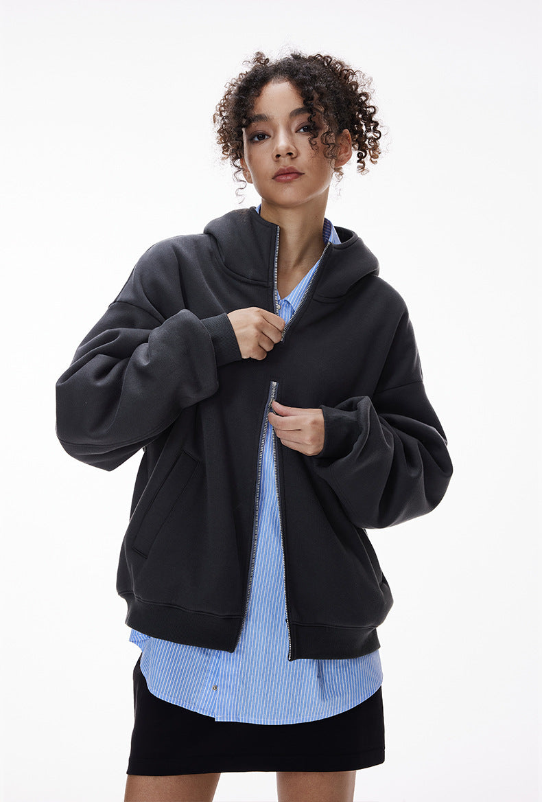 Navy blue hoodie showing two-way zipper being adjusted