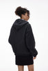 Navy blue zip hoodie back profile on female model, roomy hood
