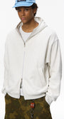 Quill gray zip hoodie on male model, hands in pockets