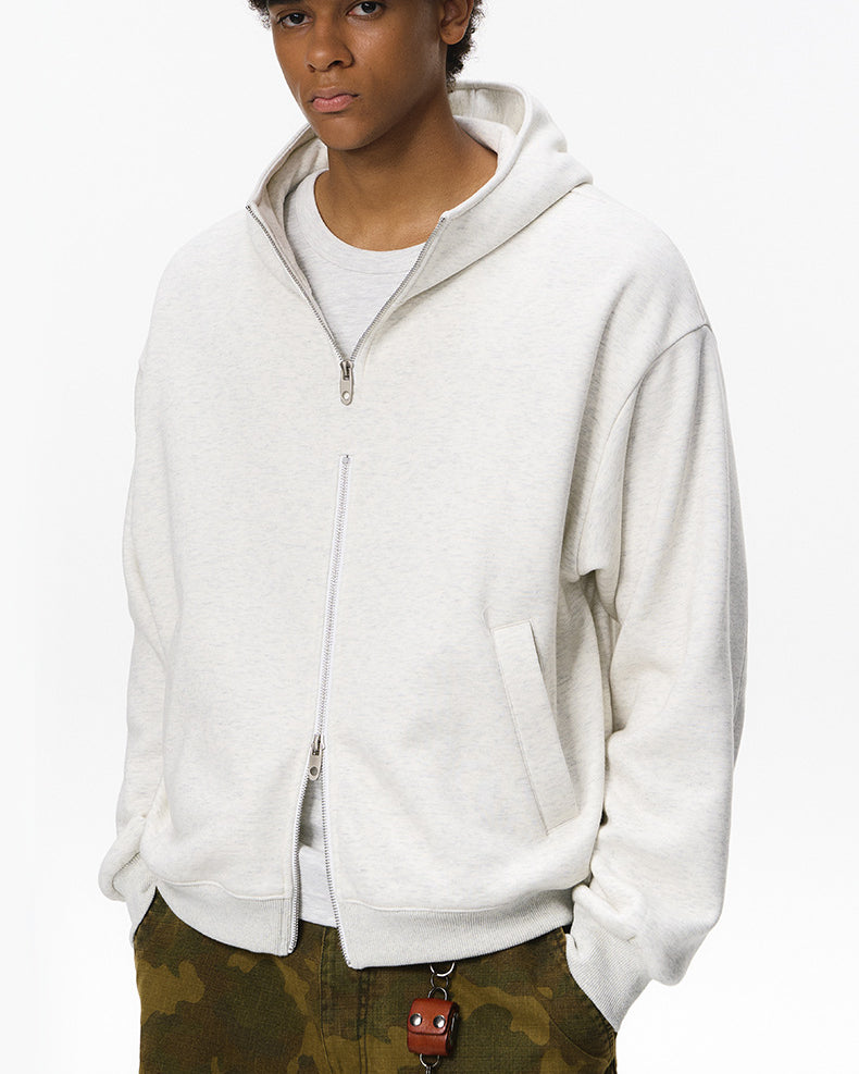 Quill gray zip hoodie on male model, hands in pockets